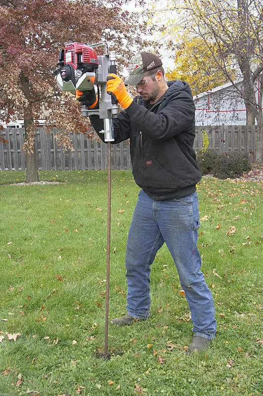 Rhino GPD-30 gas post driver sinking an 8 ft copper ground rod