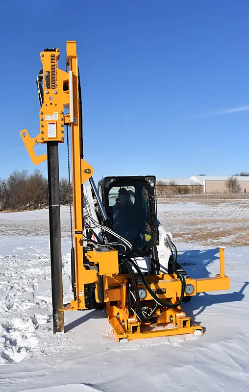 Rhino Guardrail Pro skid steer pile driver setting a tall guardrail post