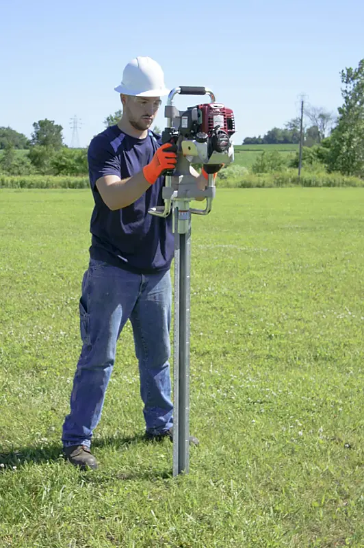 Rhino Multi-Pro GPD-45 gas post driver setting a PostMaster fence post