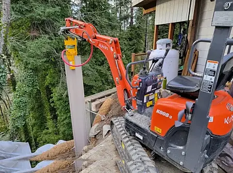 Rhino PD-200S sheet pile driver mounted on a mini excavator