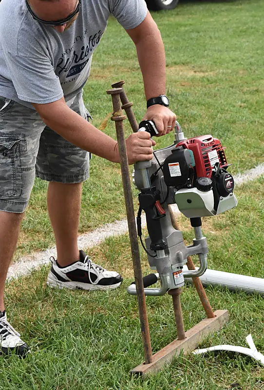Rhino Multi-Pro TS gas powered tent stake driver in use