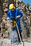 man using rock drill